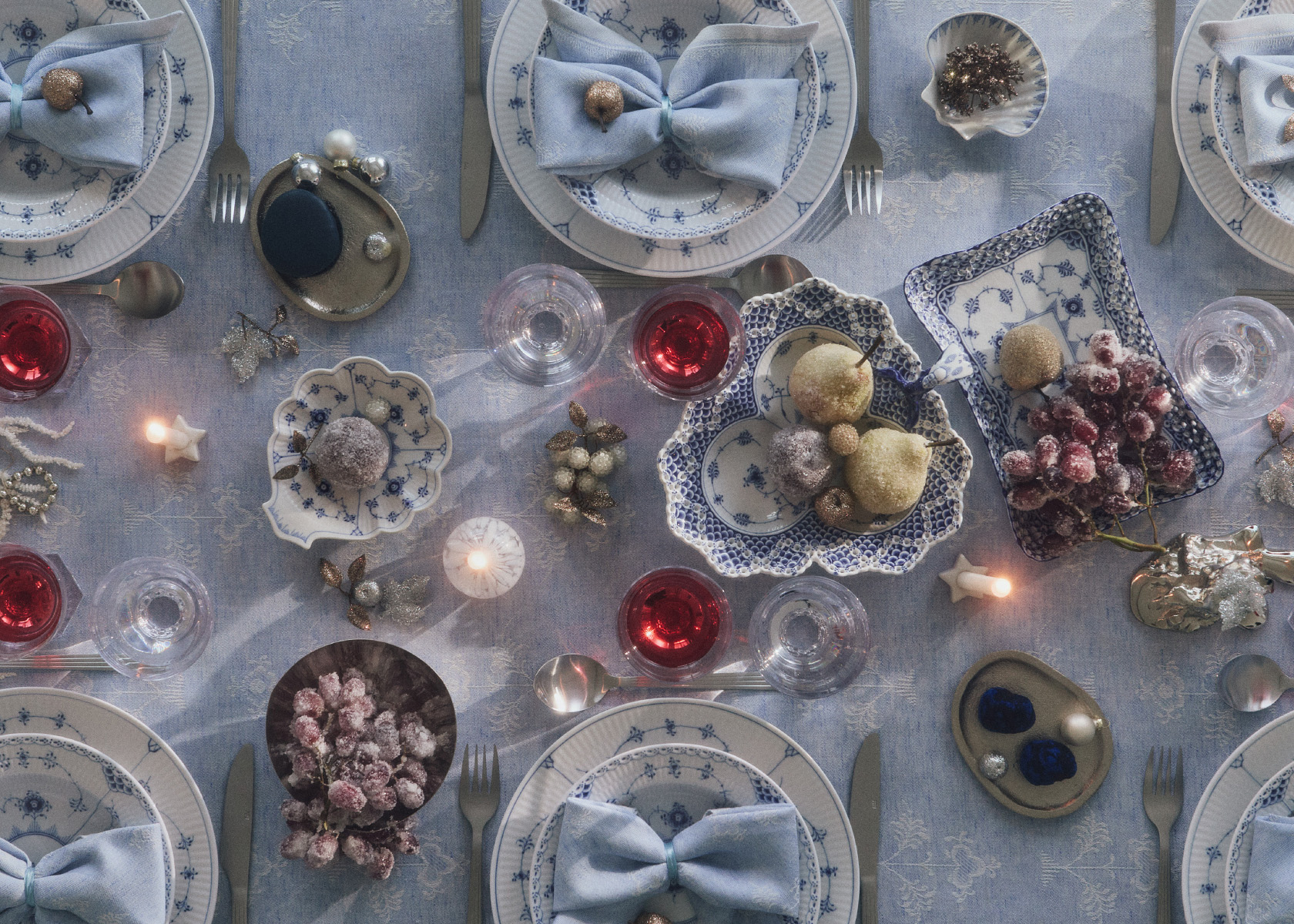 A luxurious Christmas table setting with Heritage Tablecloth and Napkins Plates from Blue Fluted Full Lace and Half lave and ddecorative pieces from Blue Fluted Full Lace
